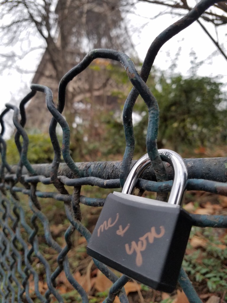 Love lock in front of Eiffel Tower with words Me & You