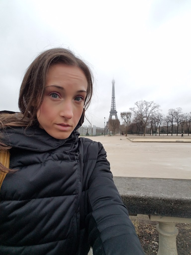 Women standing in front of Eiffel Tower in Paris
