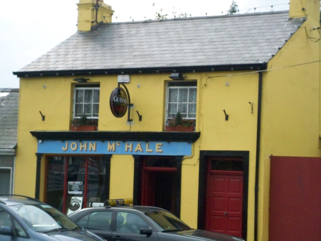 Yellow front of John McHale pub in Castlebar, County Mayo, Ireland