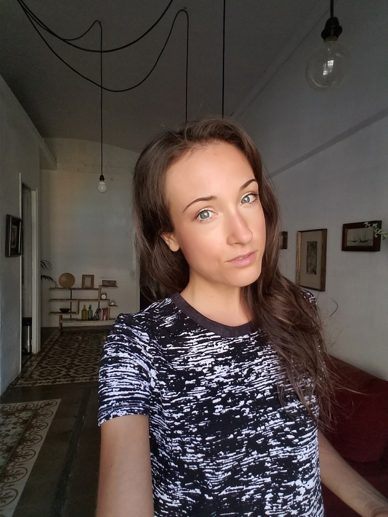 Woman taking a selfie in an apartment in Barcelona Spain