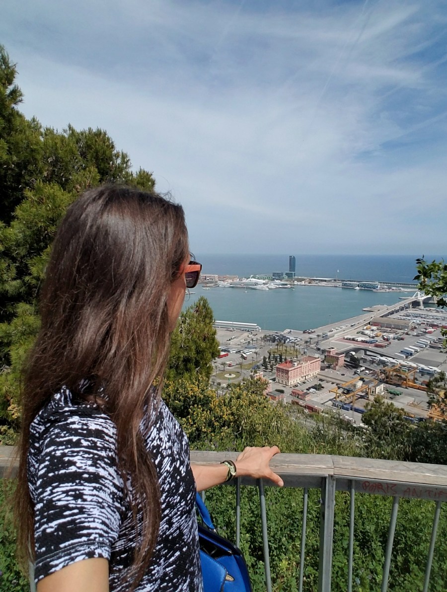 Woman looking over the water in Barcelona Spain