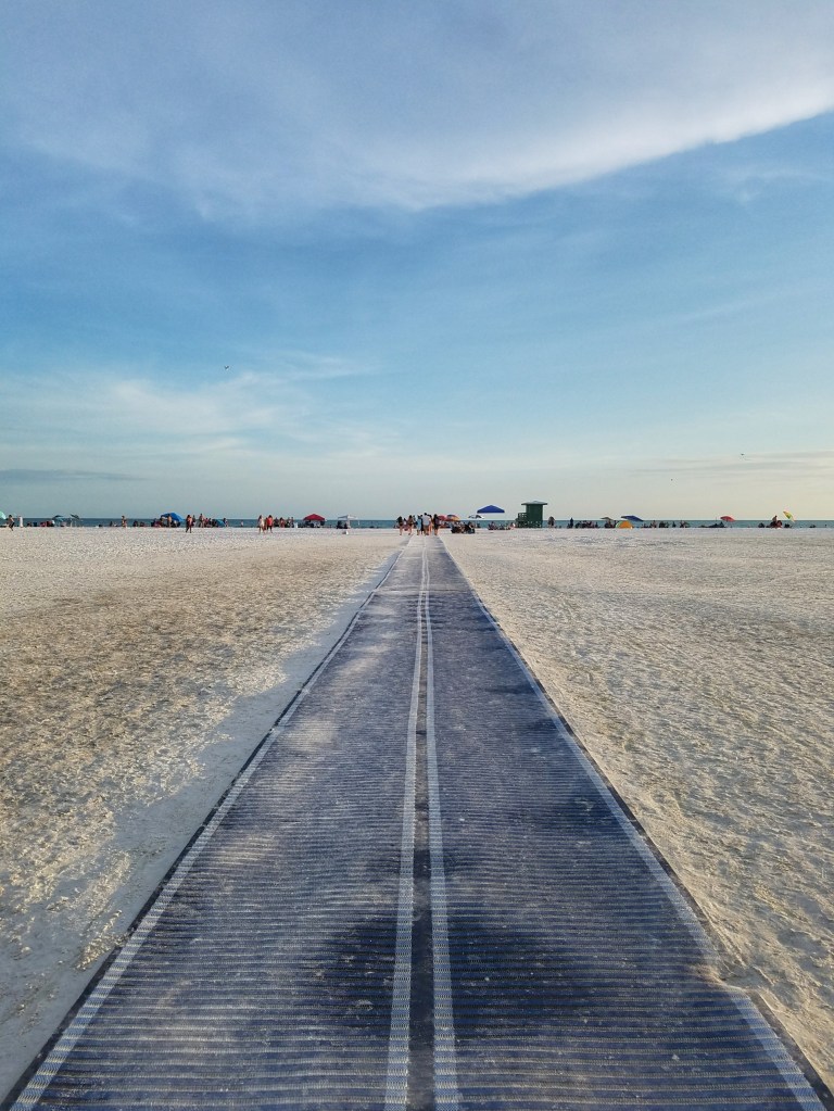 Walking mat at white sand beach on Siesta Key in Sarasota Florida