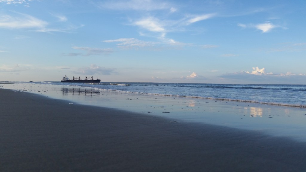 Tybee Island beach with freighter