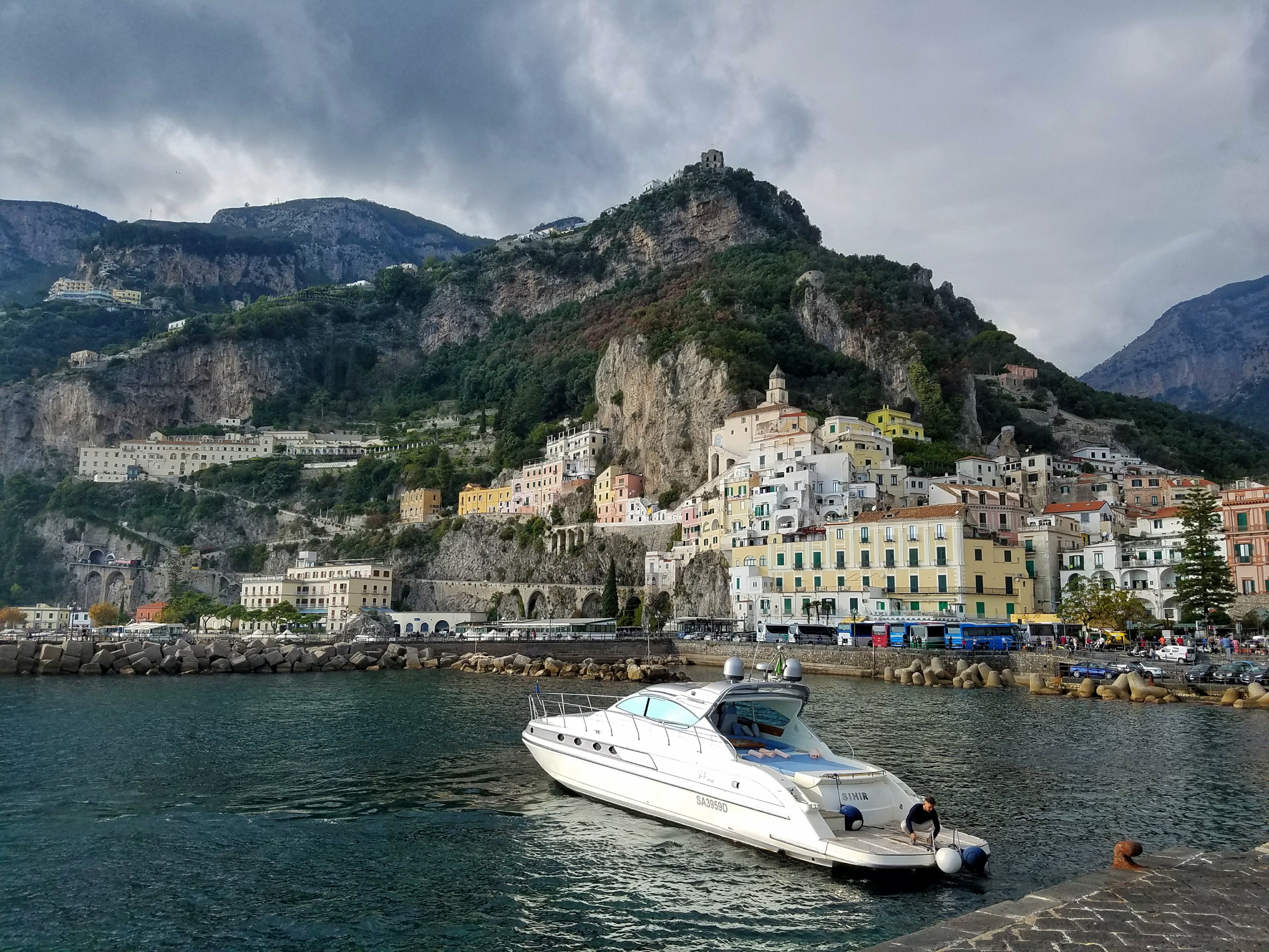 View of Amalfi, Italy from the water, with luxury boat in the harbor