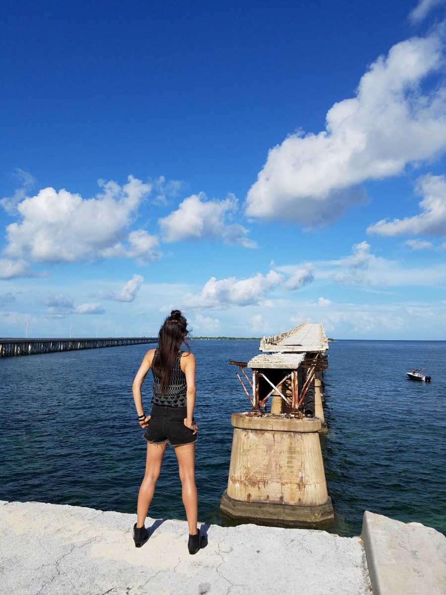 Woman standing near the old railroad bridge in the Florida Keys
