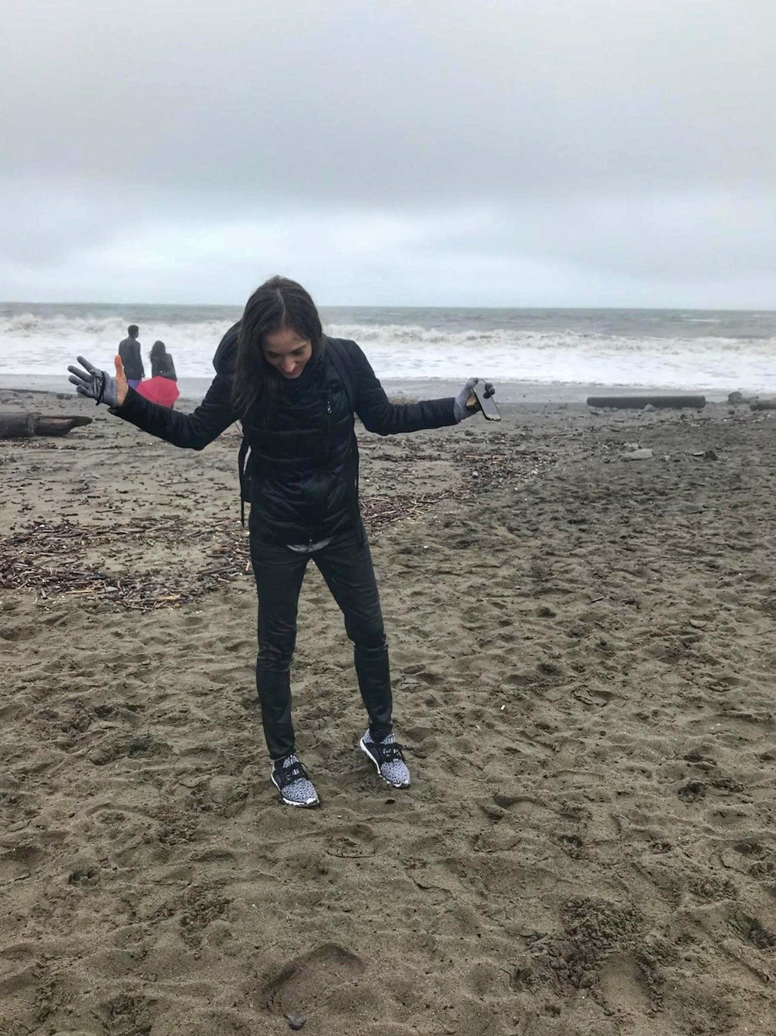 Woman in wet clothes at the beach