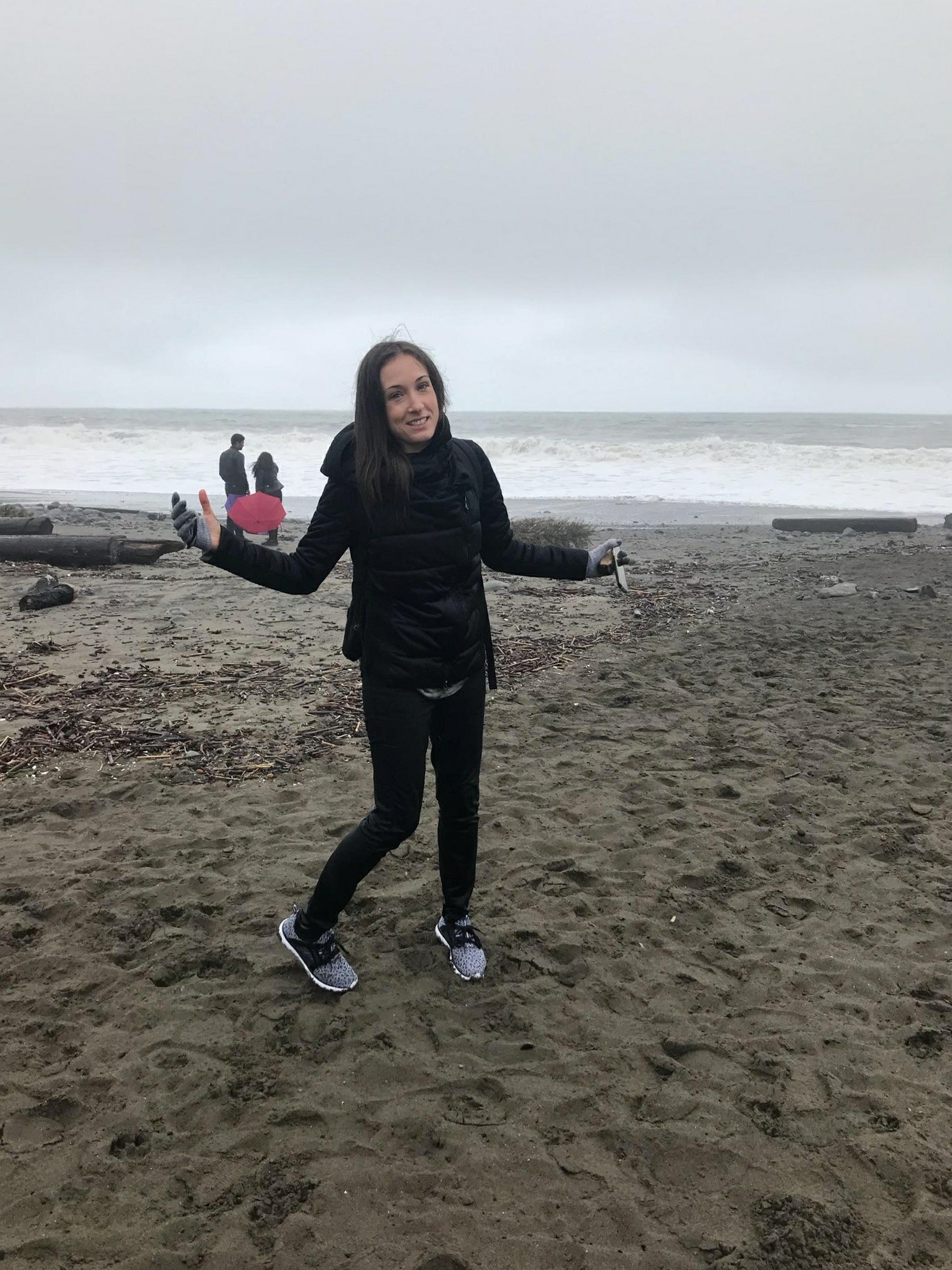 Woman smiling in wet clothes at the beach