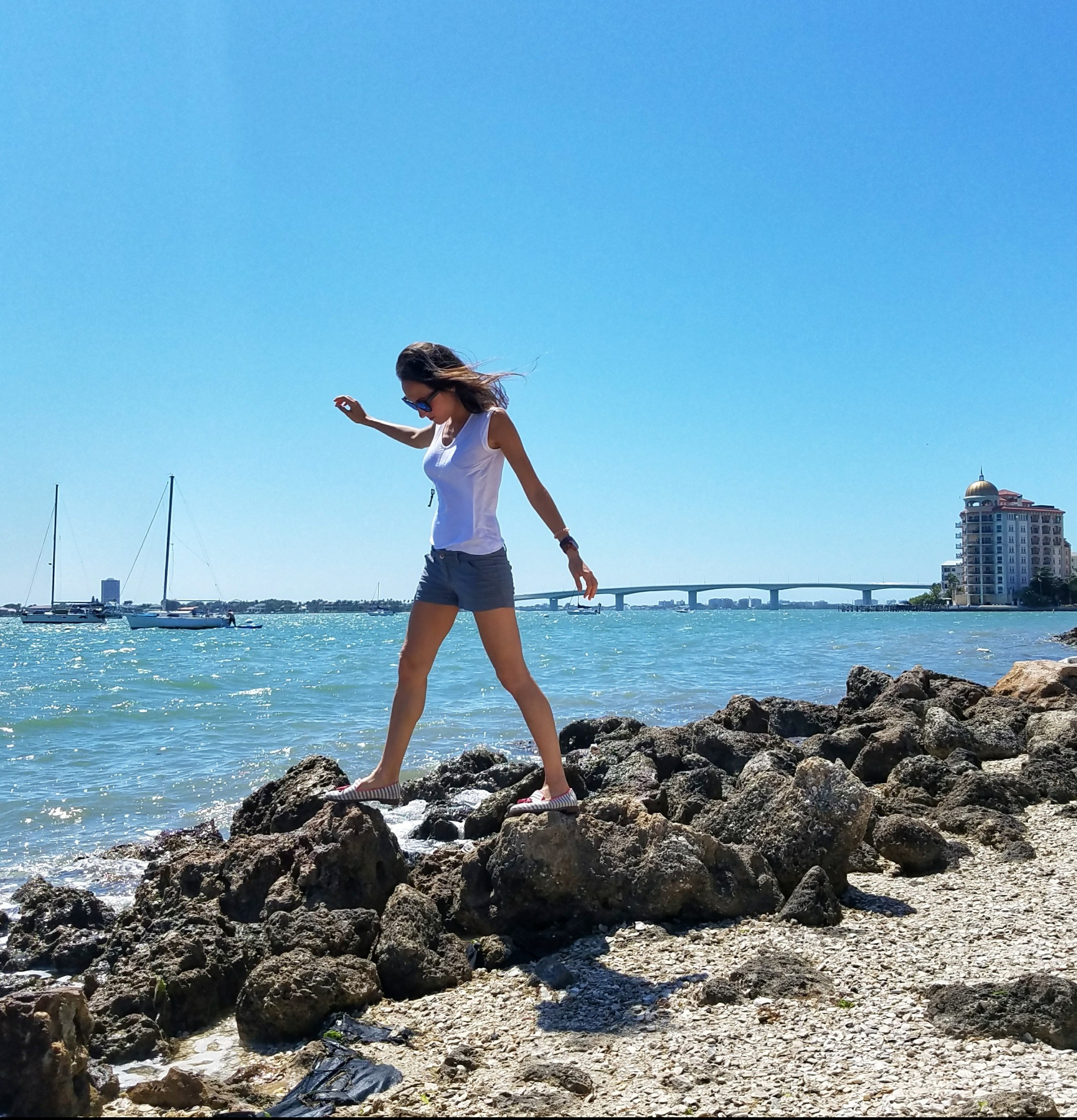 Woman walking on rocks in Sarasota Florida