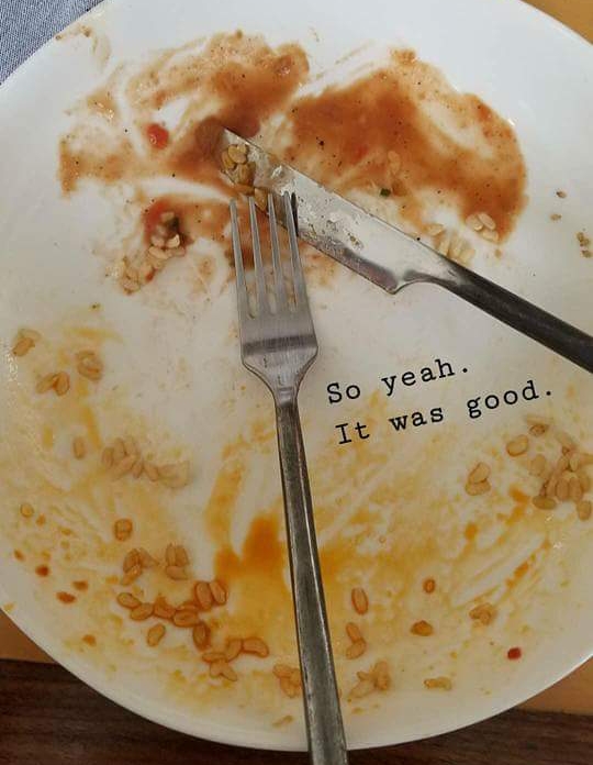 Empty plate with fork, knife and remaining sauce from food