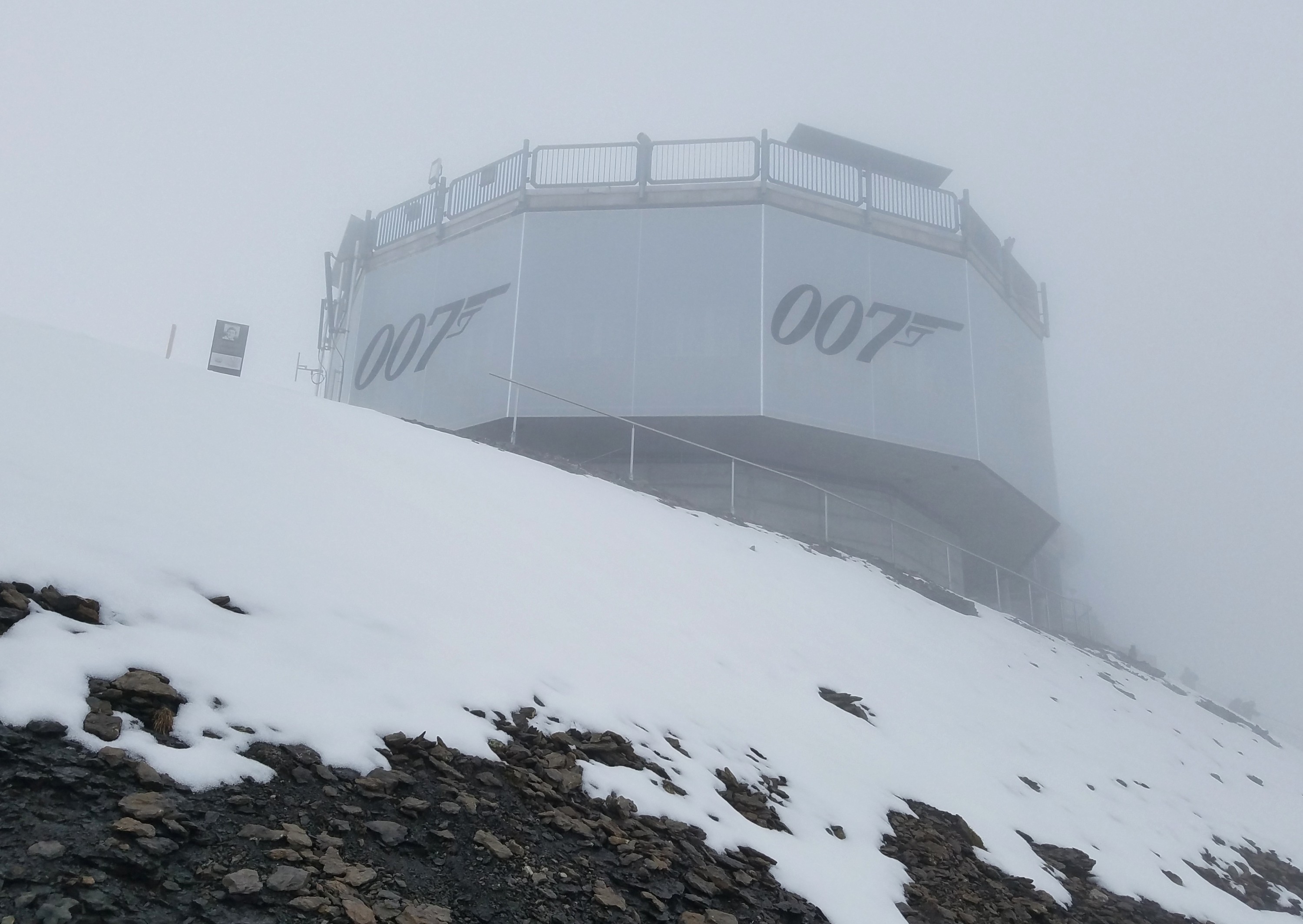 007 logo on a building in the fog
