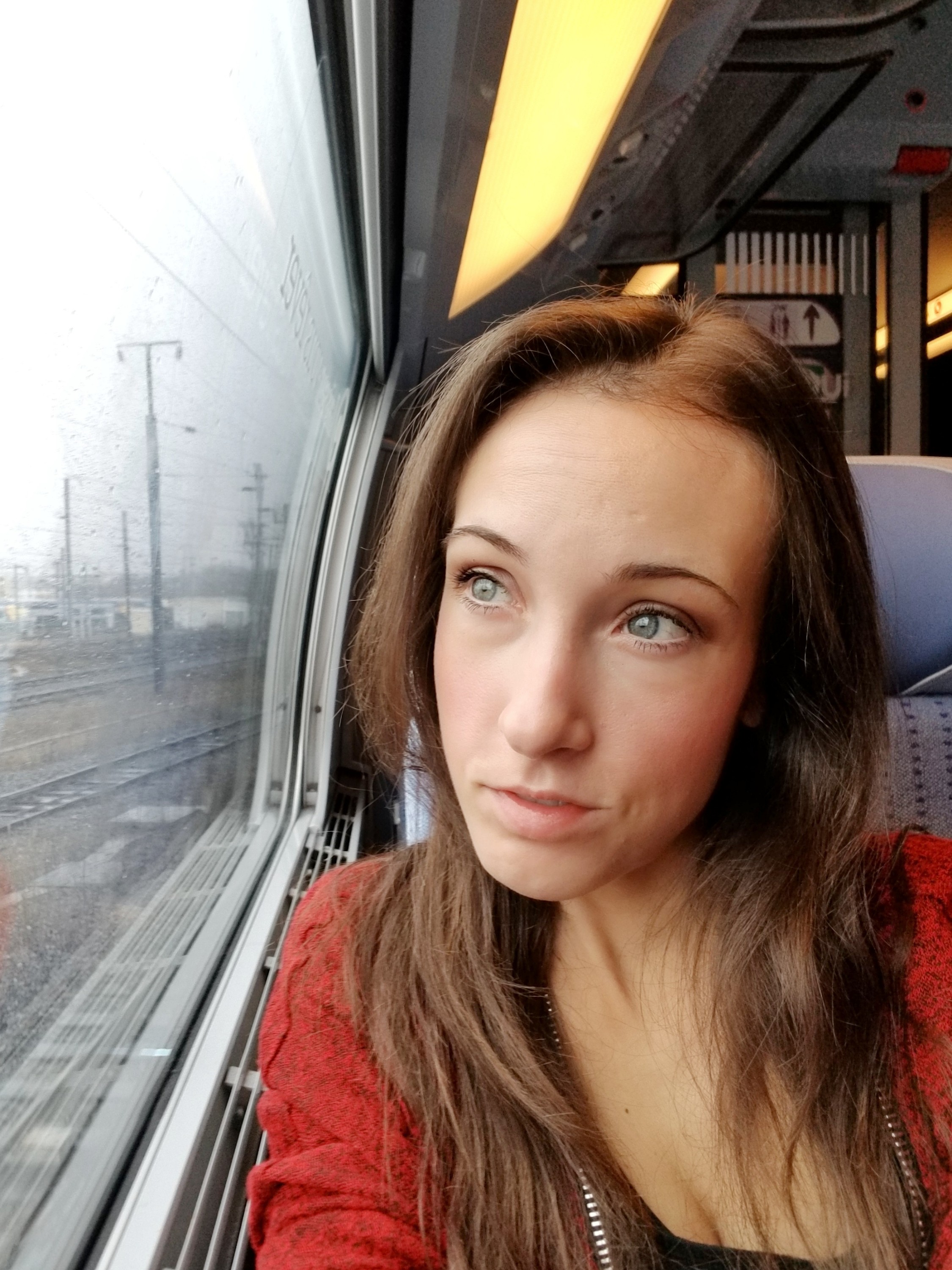 Woman looking out the window on a train
