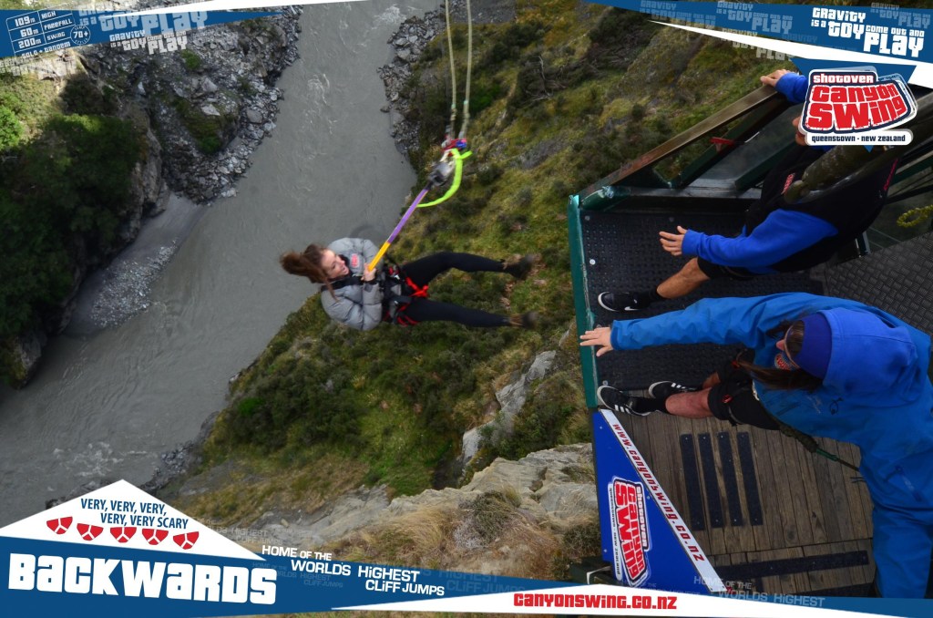 Woman canyon swinging in New Zealand