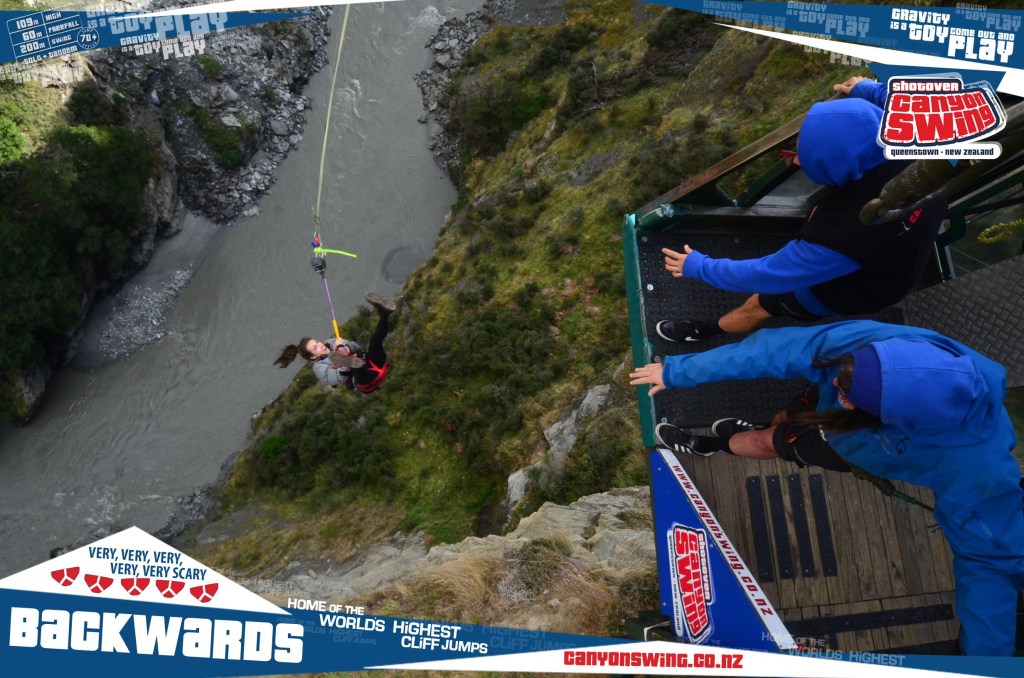 Woman canyon swinging in New Zealand