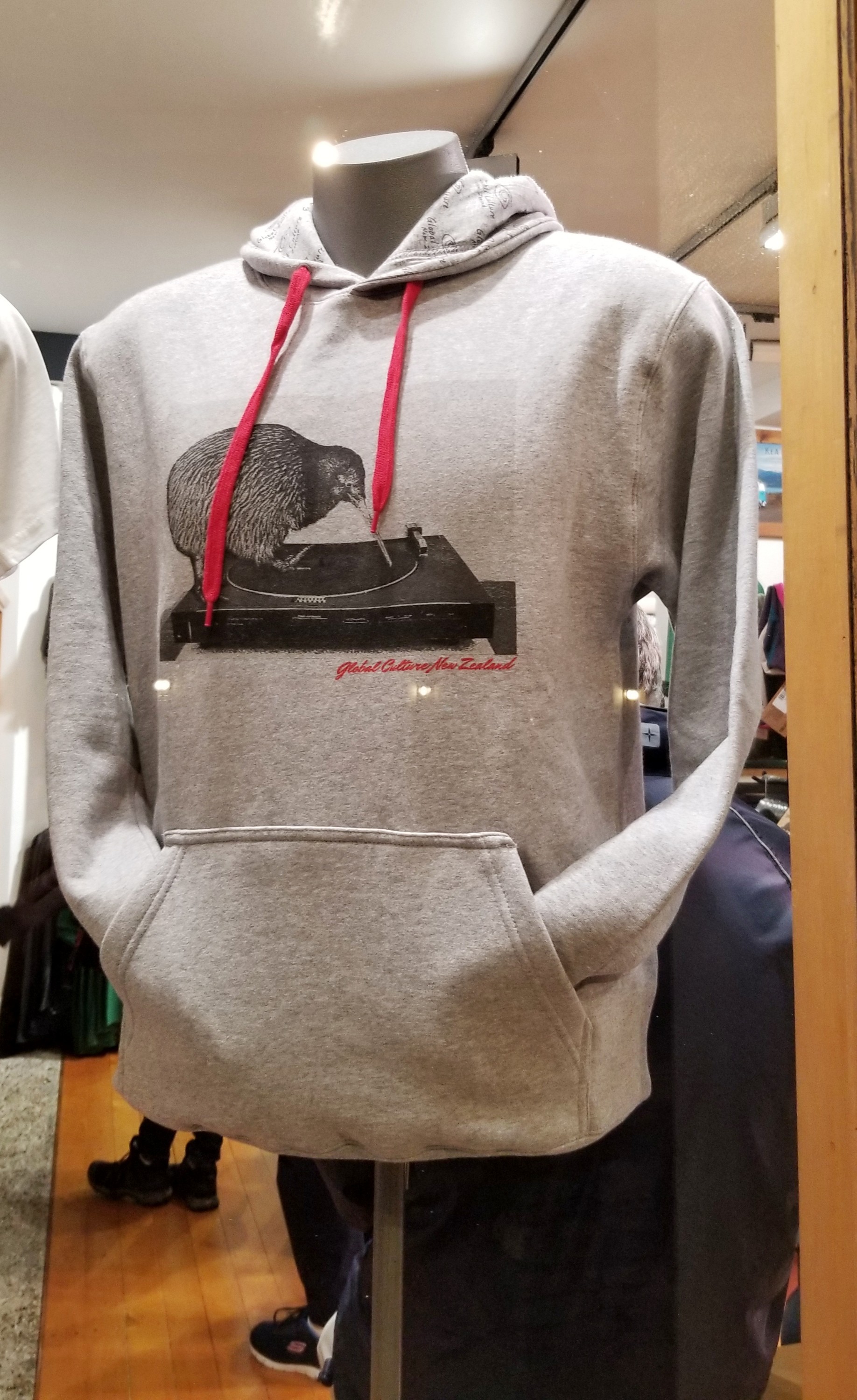 Gray sweatshirt with a kiwi bird and turn table graphic
