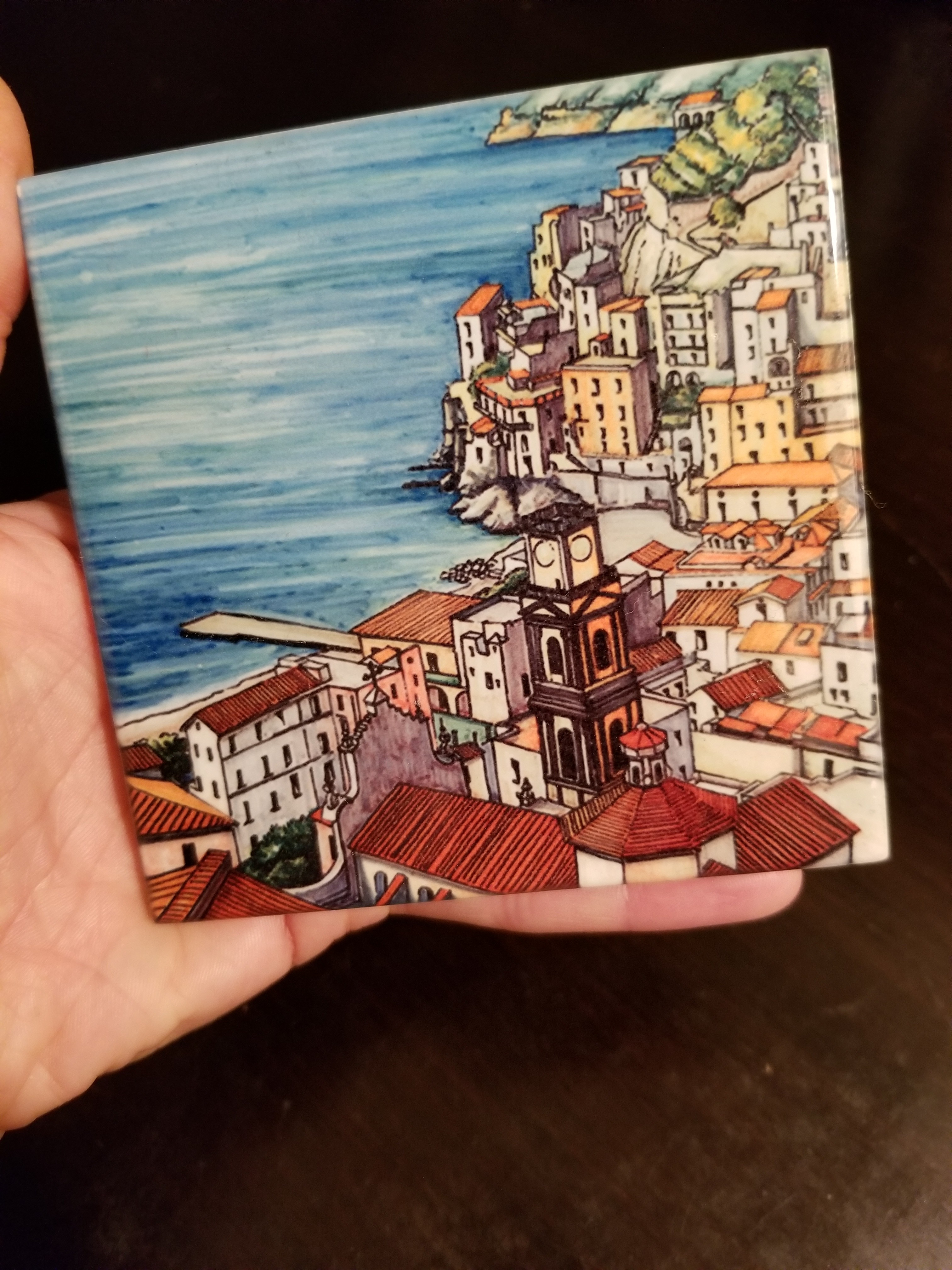 Ceramic tile with an Italian town painted on it