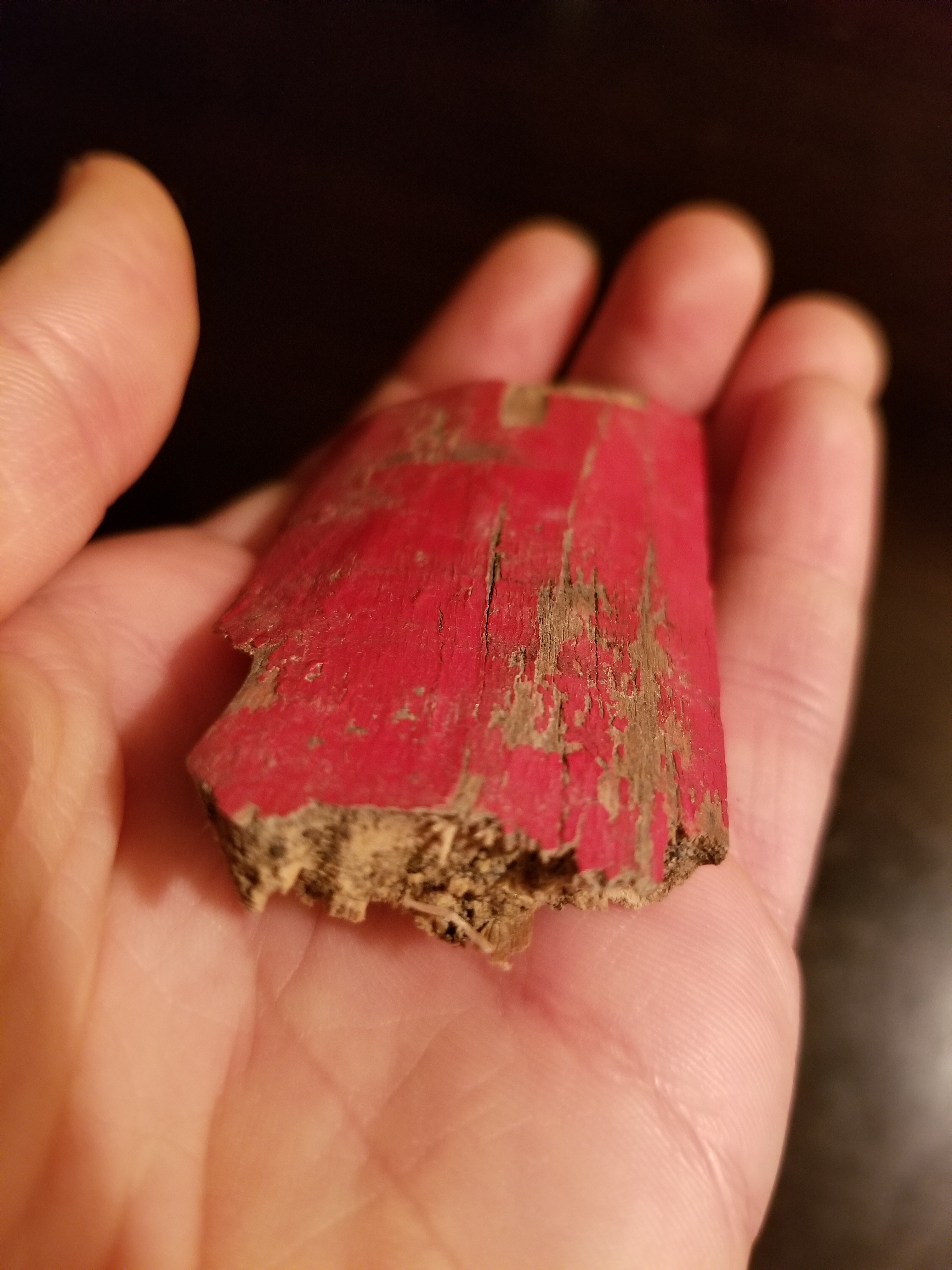 Piece of wood painted red