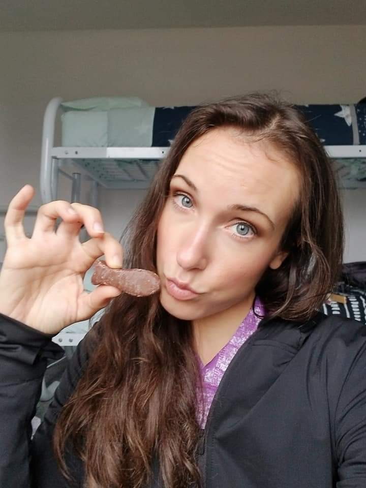 Woman holding a chocolate fish candy
