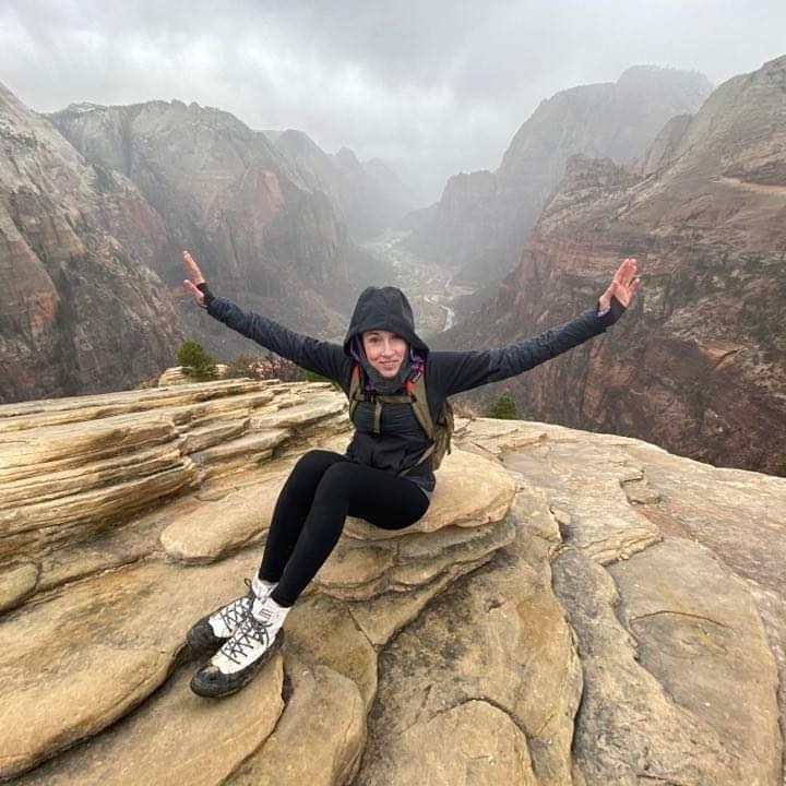 Woman hiker at the top of Angels Landing Zion National Park 