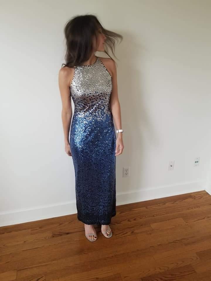 Woman in sequin dress flipping her hair