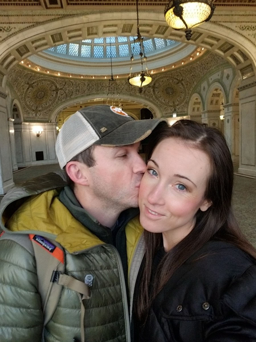 Man kissing woman's cheek