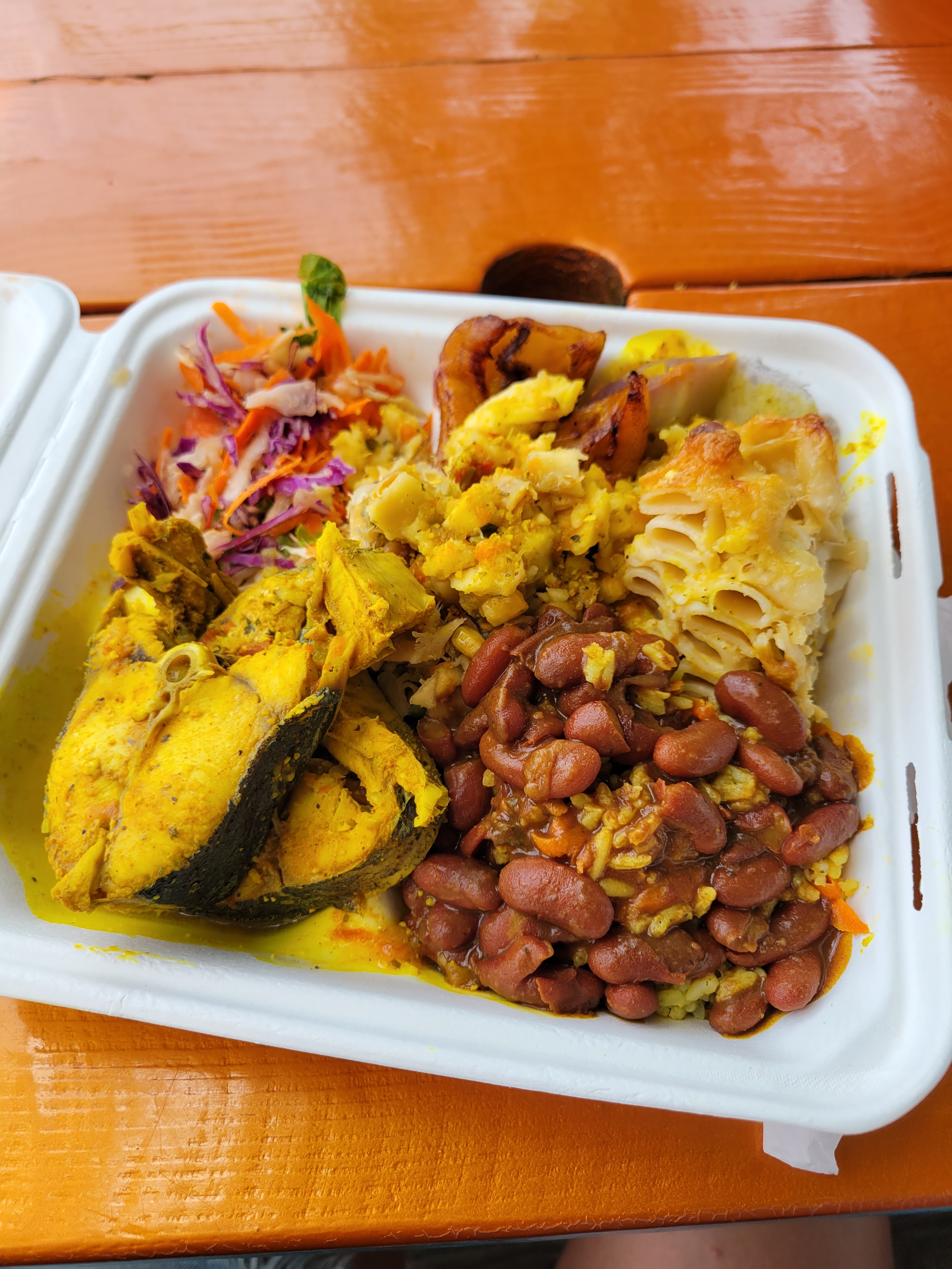 Styrofoam container of authentic Caribbean food in St. Lucia