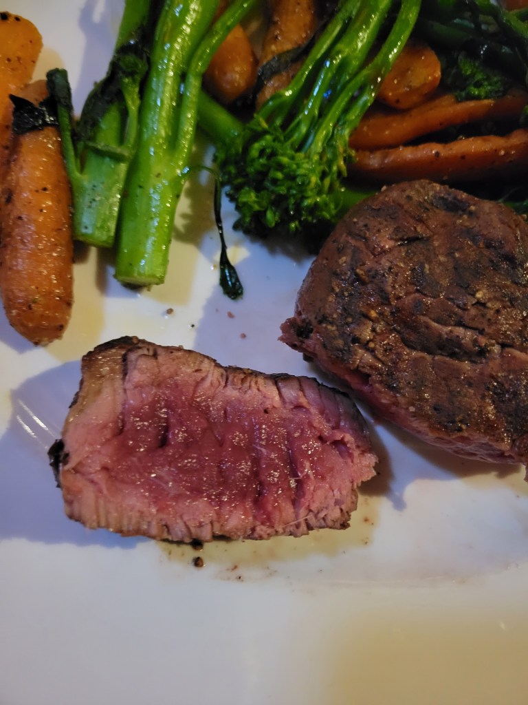 Medium rare bison steak Montana Ale Works Bozeman