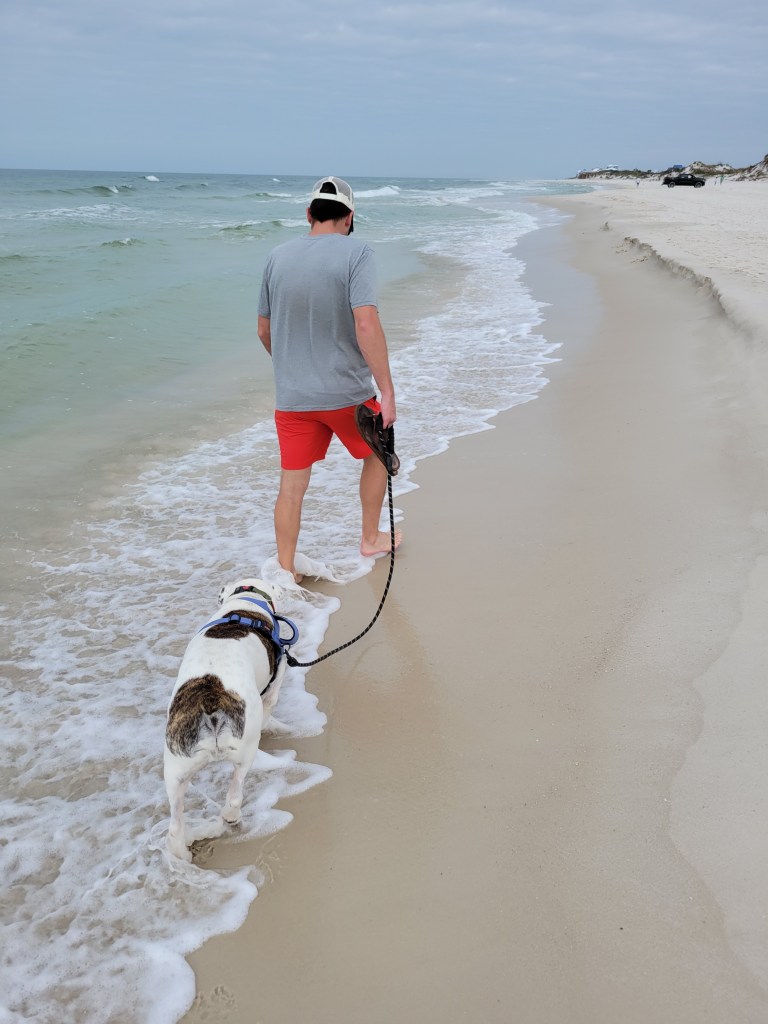 Man and dog on Cape San Blas Beach Florida