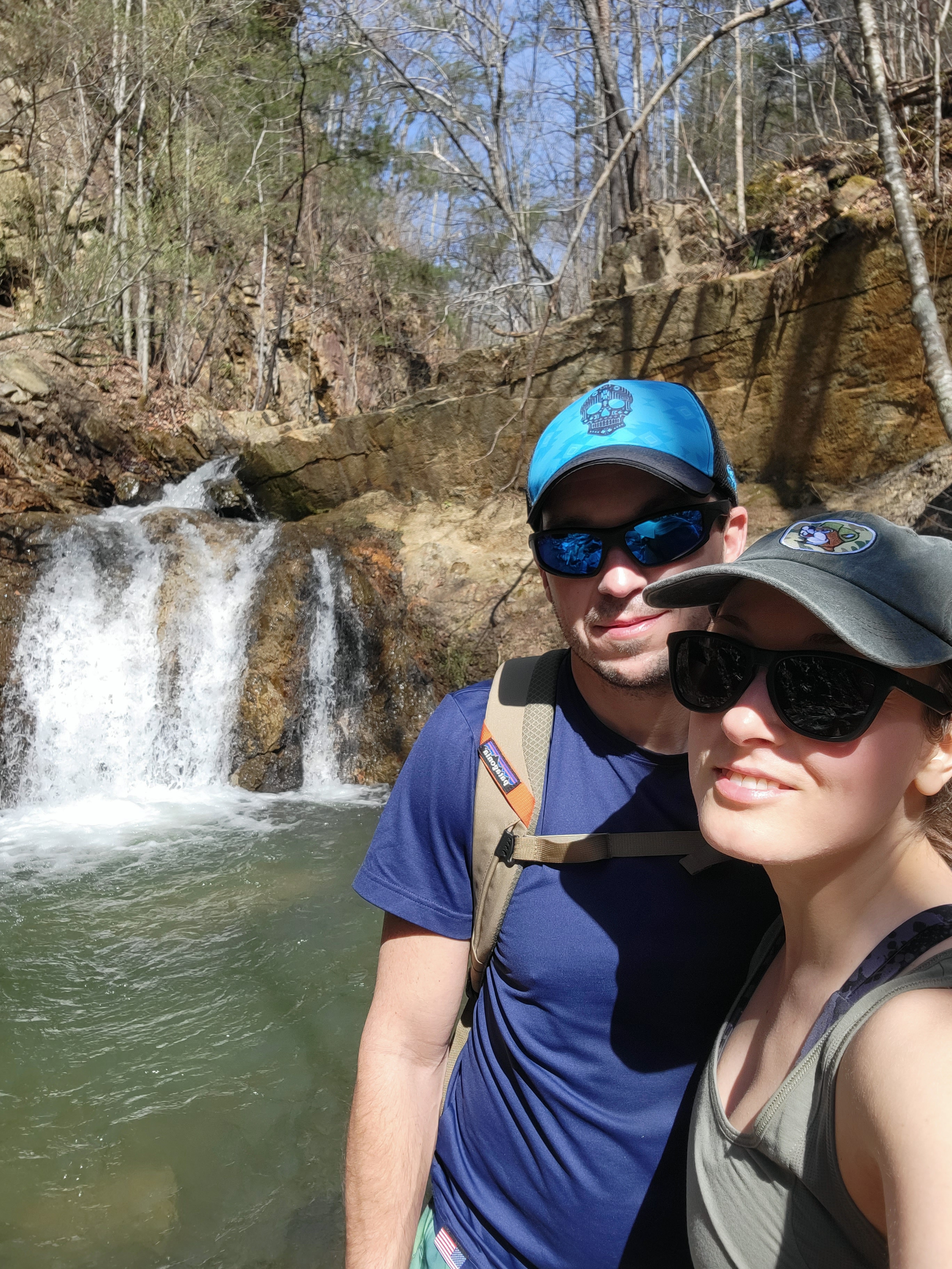 Man and woman in front of a waterfall 