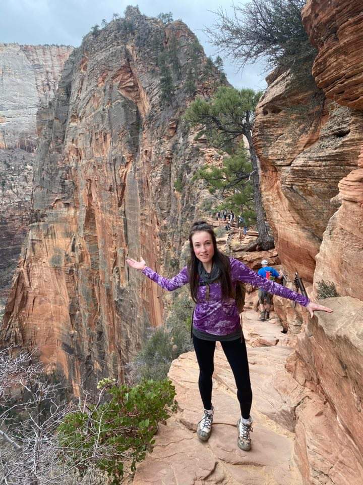Hiker posing on Angels Landing trail Zion National Park 