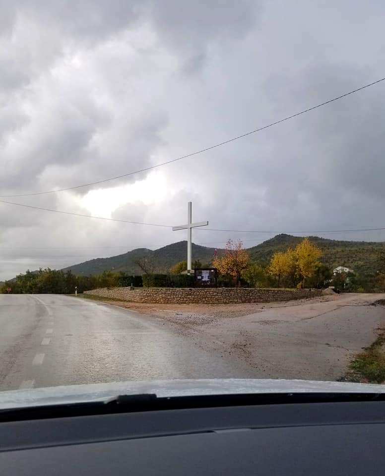 Large white cross on the roadside in Bosnia and Herzegovina