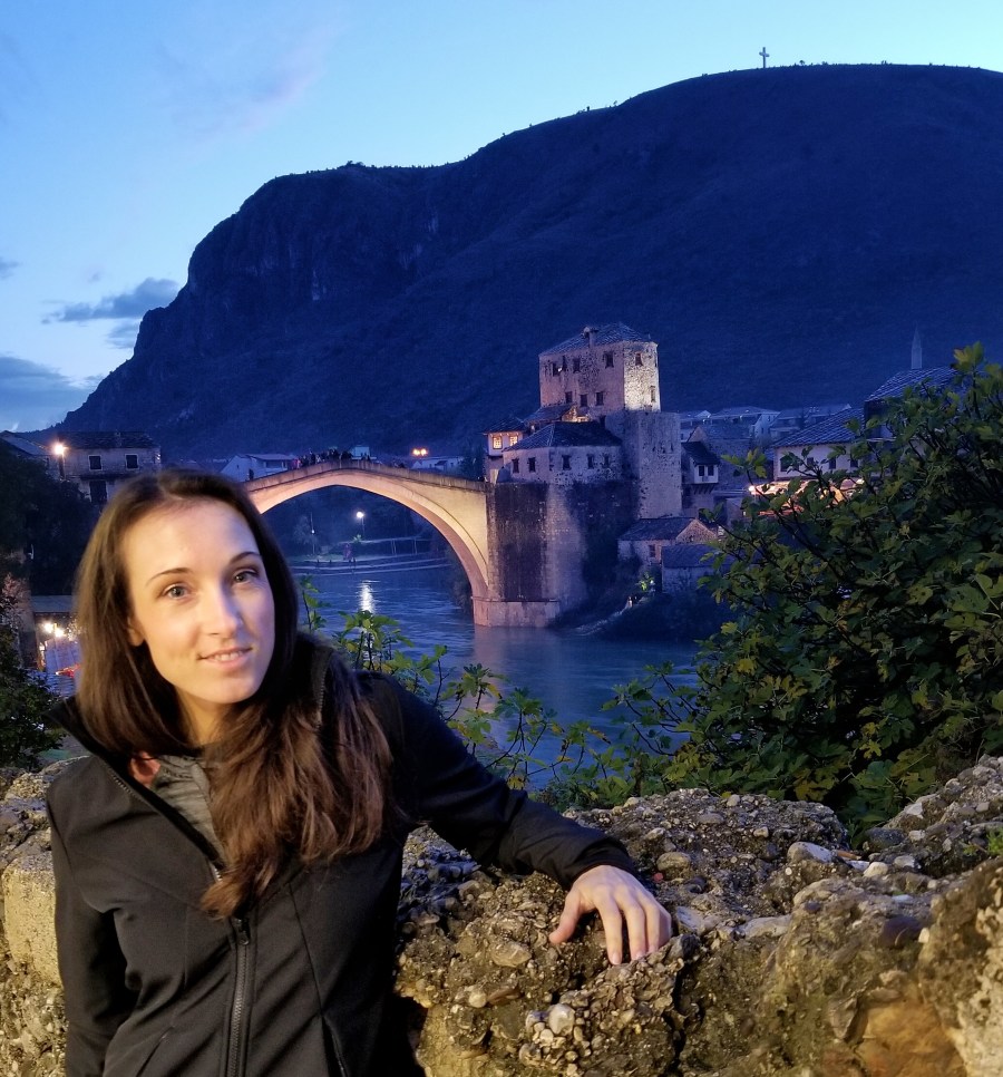 Woman posing in front of Stari Most Bridge in Mostar Bosnia