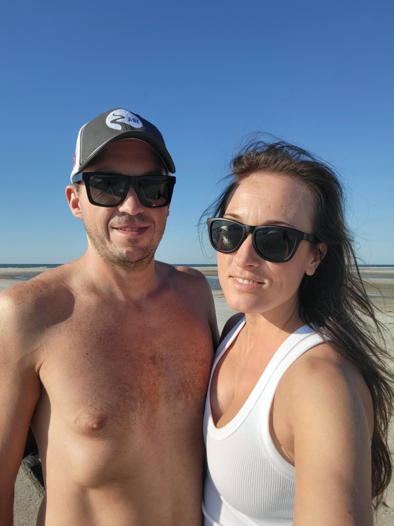 Couple posing on the beach