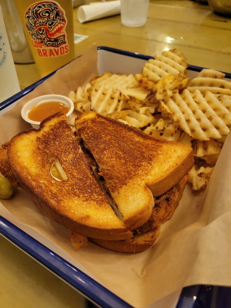 Grilled sandwich and waffle cut fries