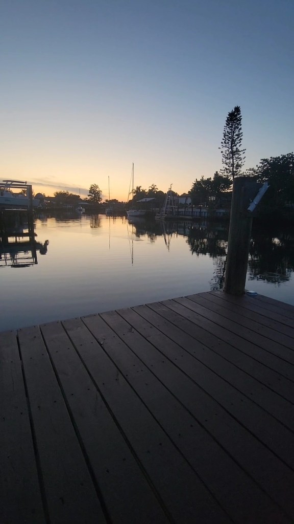 Canal at sunset with a ripple in the water