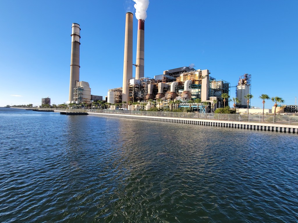 A Big Bend power station in Apollo Beach, FL with manatees in the water