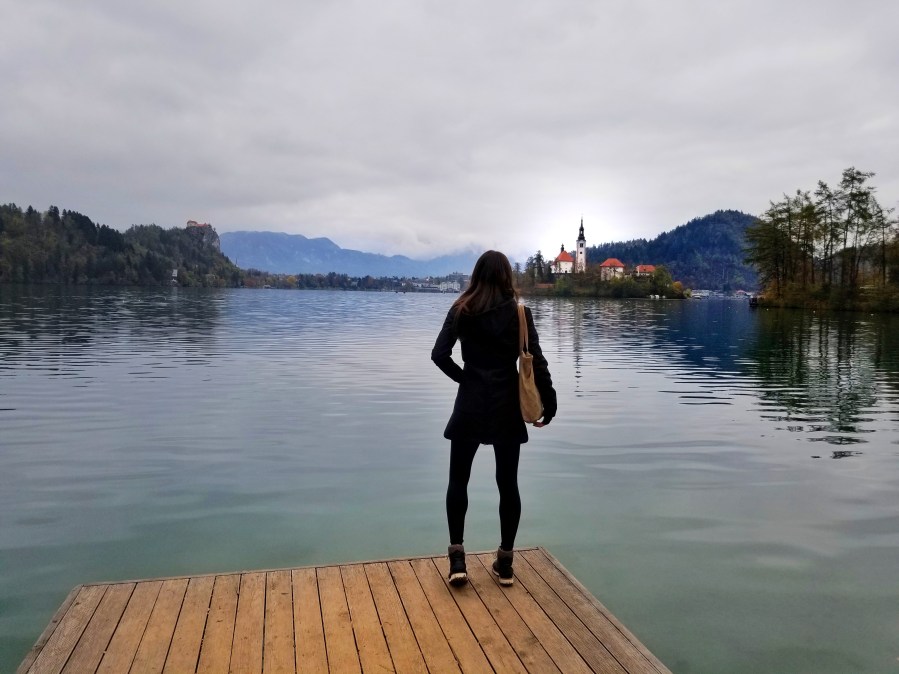 Woman looking out at a lake