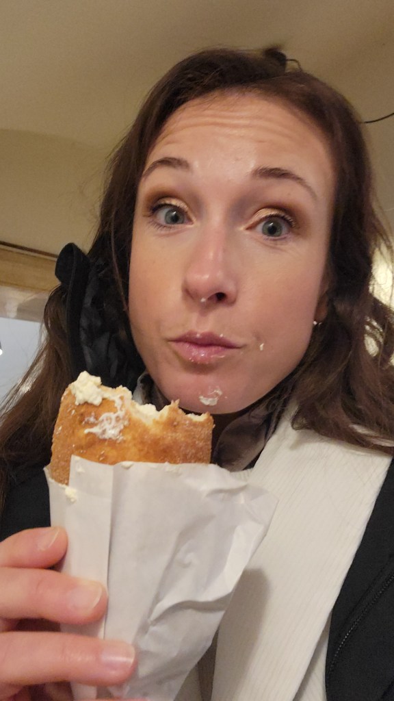 Woman eating a chimney cake