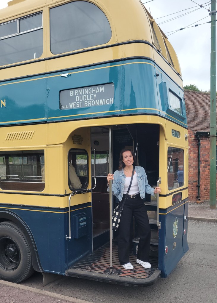 Woman on an old double decker bus