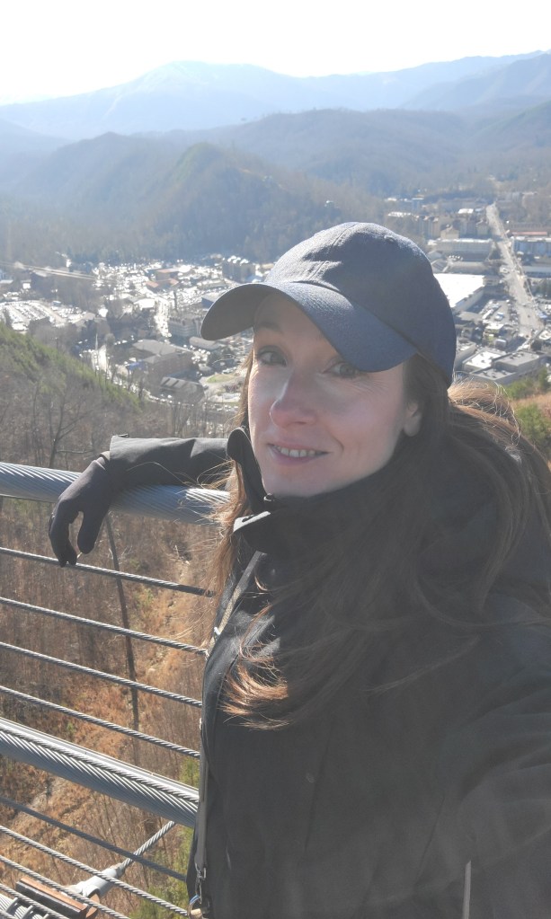 Woman posing on a pedestrian cable bridge in the Smoky Mountains Tennessee