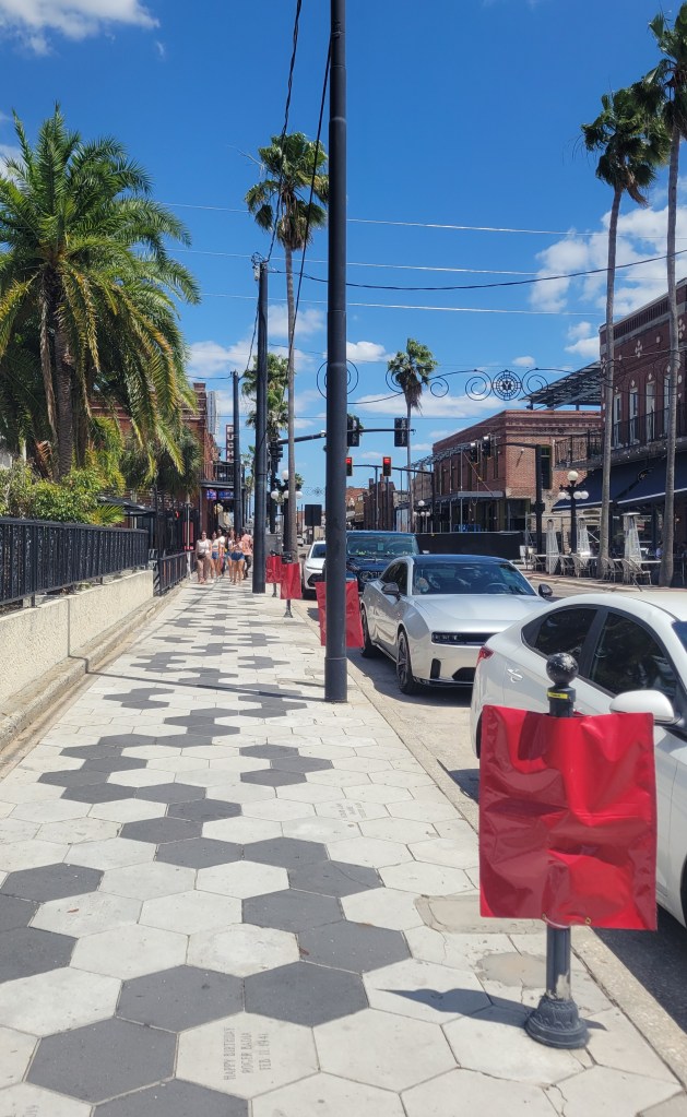 Ybor City, Florida sidewalk with hexagon papers and palm trees