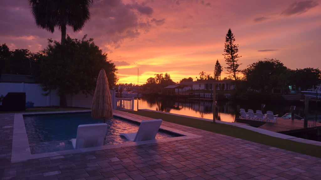 Backyard pool at sunset