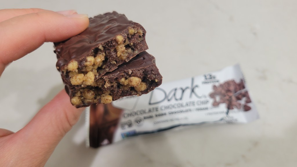 NuGo Chocolate Chocolate Chip protein bar inside and outside of bar