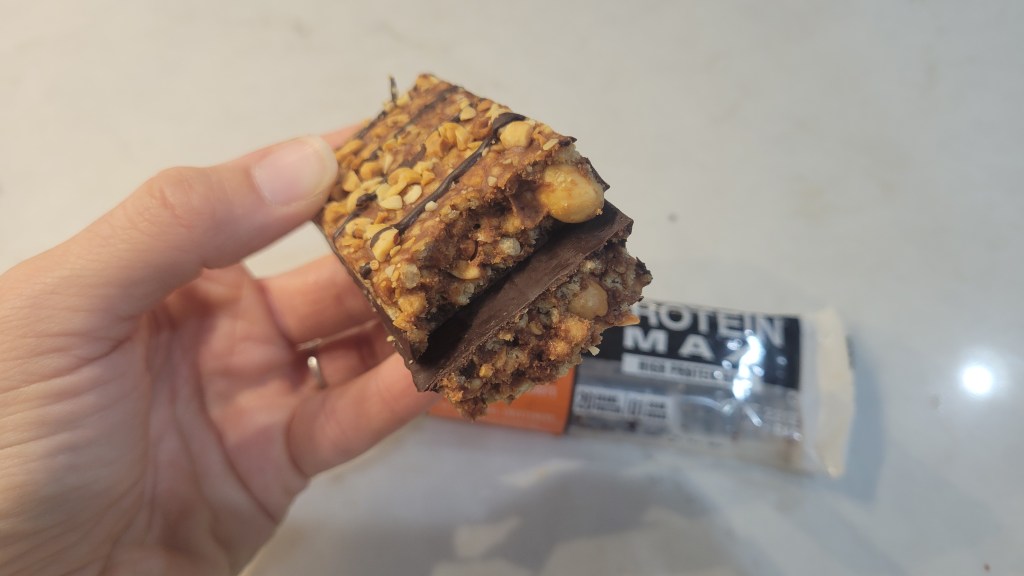 KIND MAX Protein Bar showing the inside and outside texture