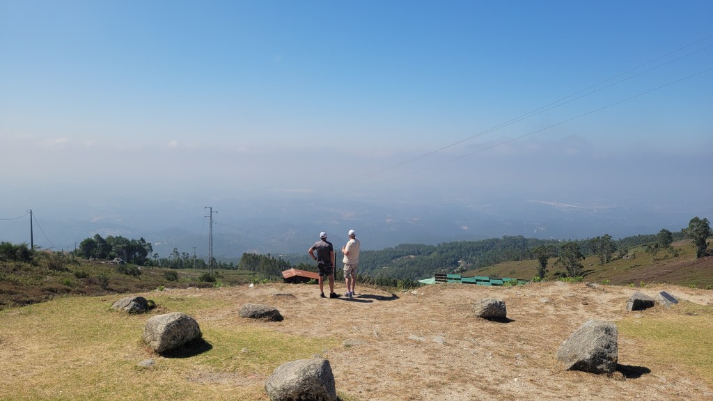 Two men on top of a mountain