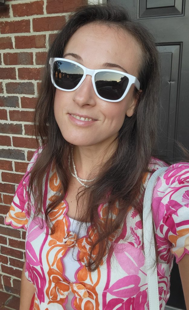 Woman wearing white sunglasses