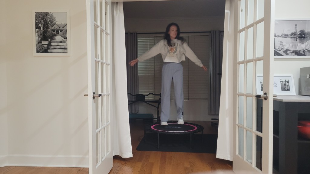 Woman jumping on a mini trampoline